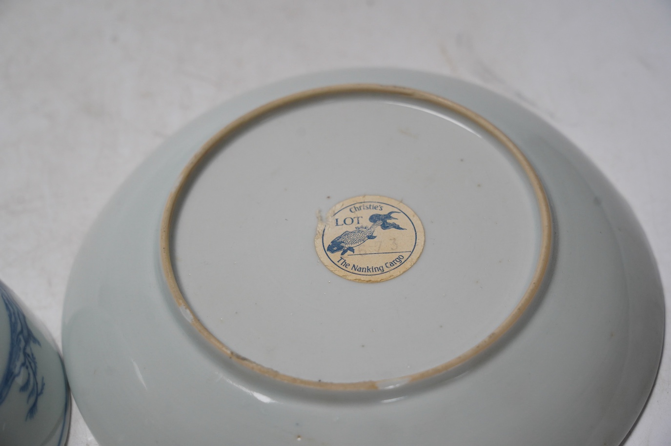 A large Chinese Nanking cargo blue and white tea bowl and saucer, saucer 17.5cm. Condition - good